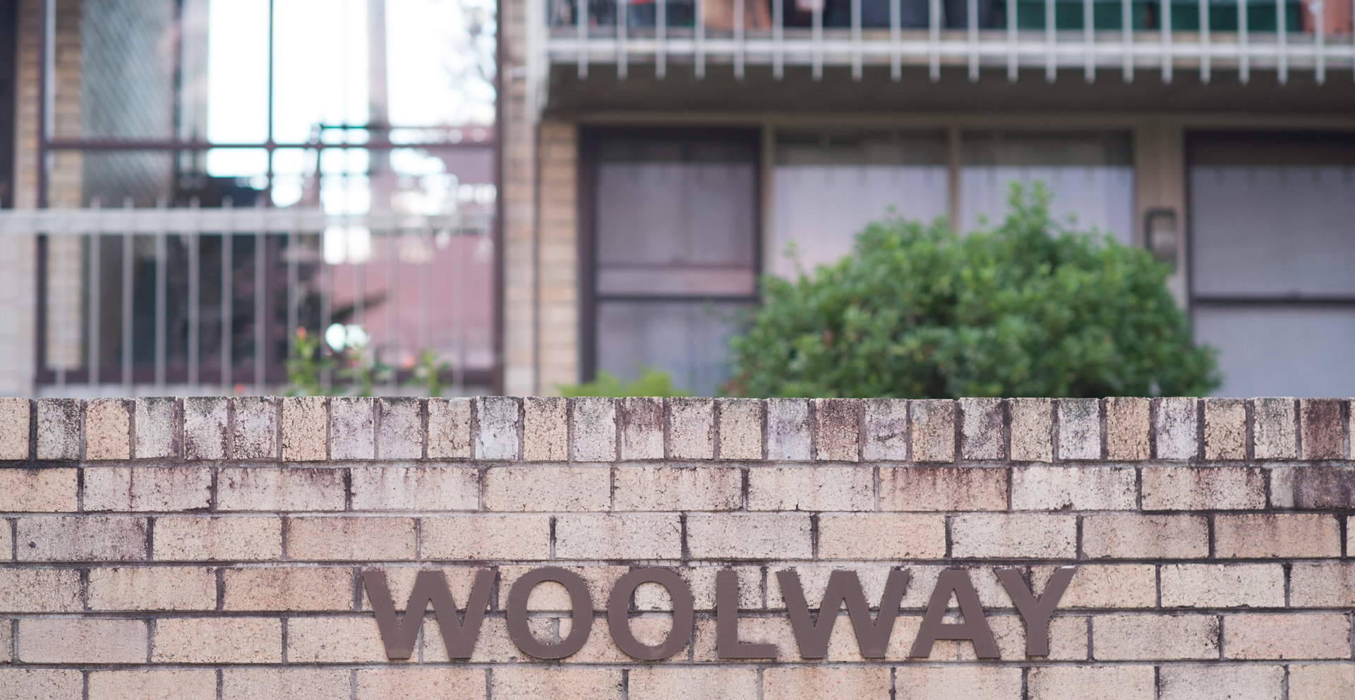 Woolway Sign on Brick Wall